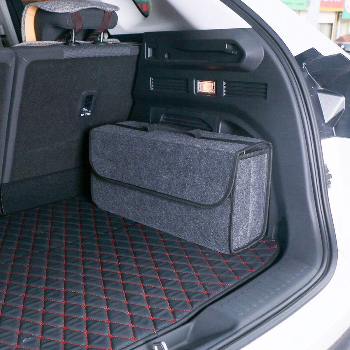 Felt car trunk organizer sitting in an SUV cargo area